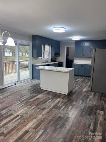 a living room with a couch and a wooden floor