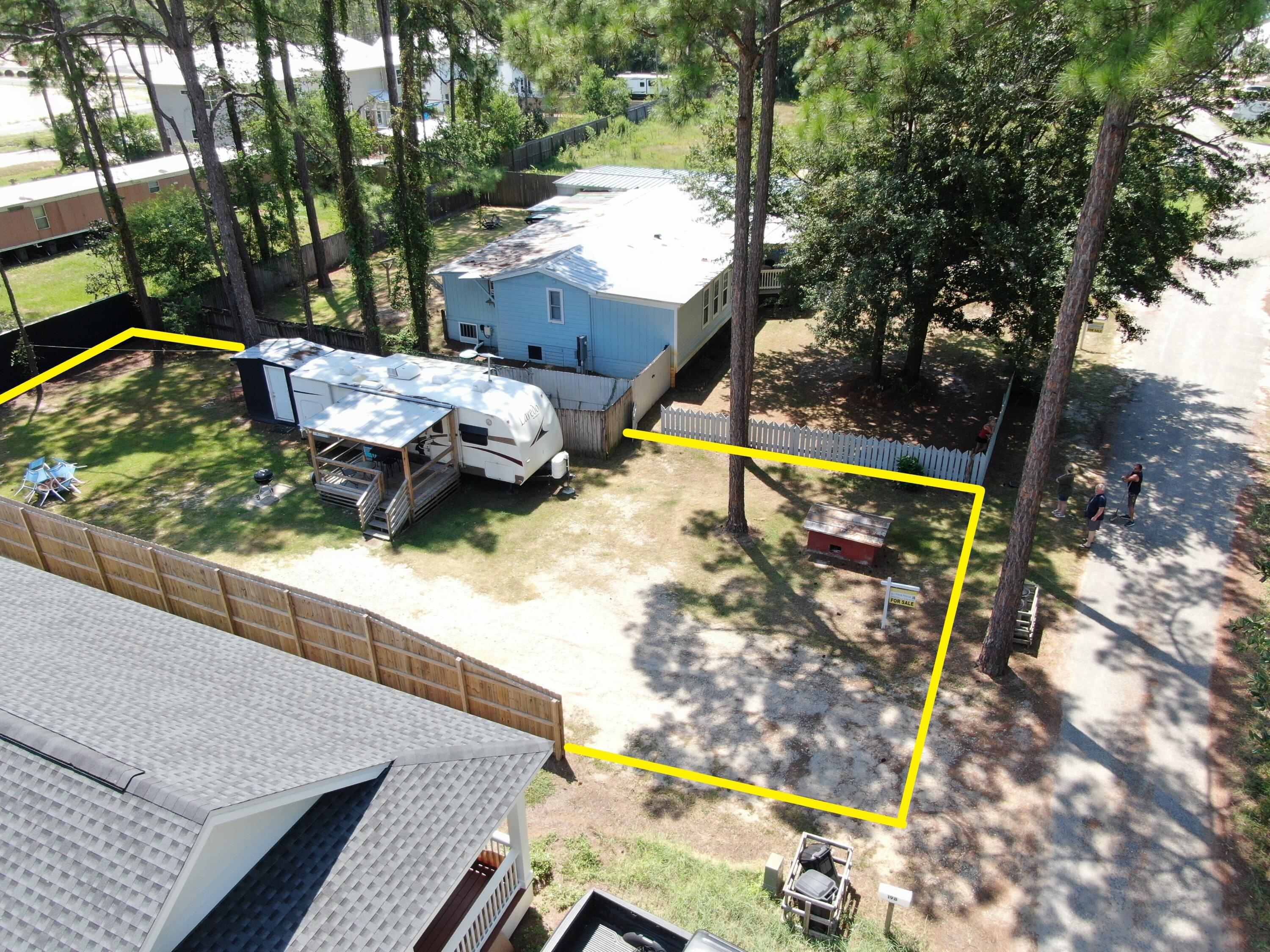 a view of swimming pool with a patio and wooden fence