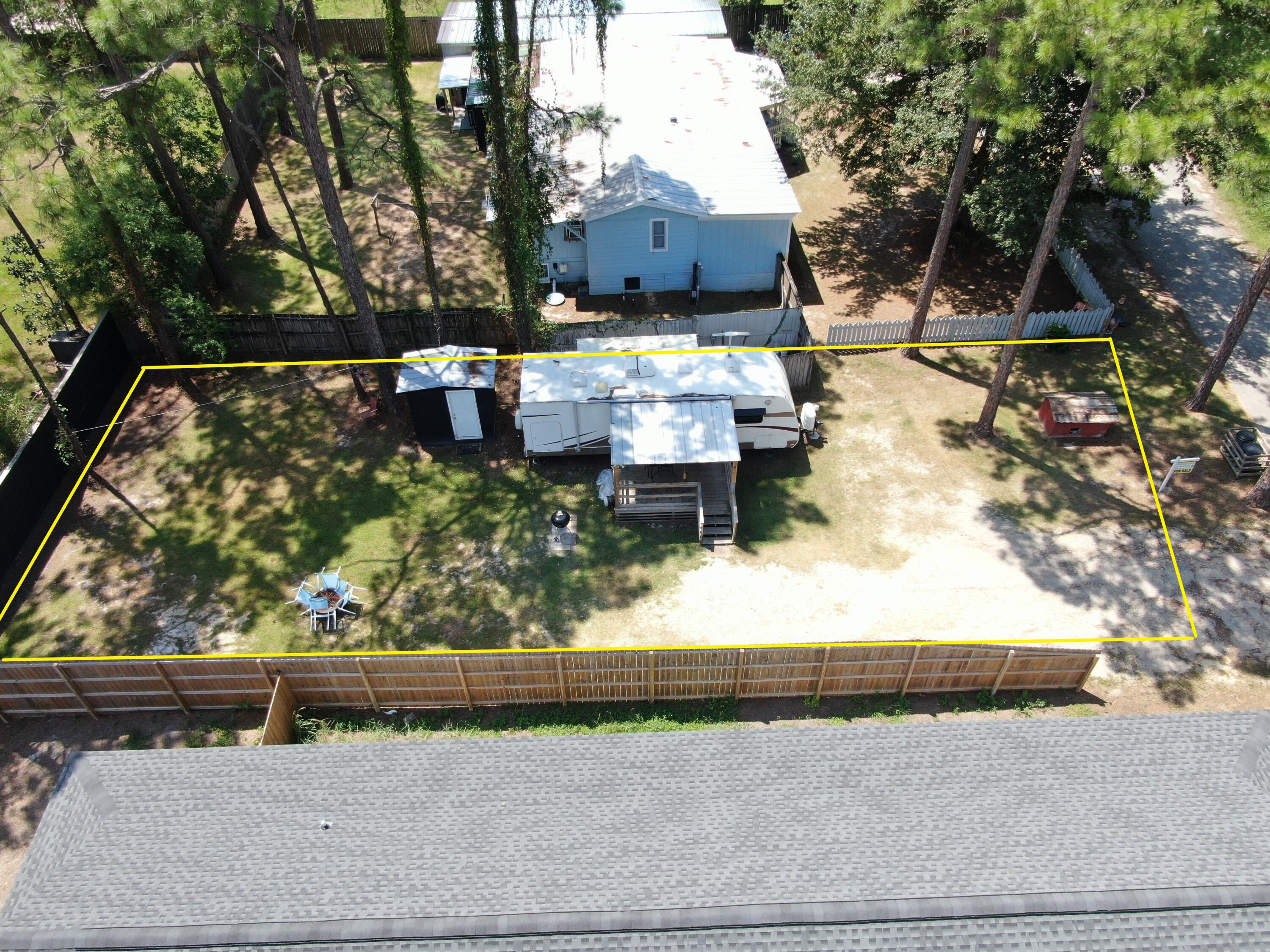 Tbd Tbd 1st St Point Santa Rosa Beach, FL 32459 - Photo 7 of 8 a view of backyard with wooden floor and a fire pit