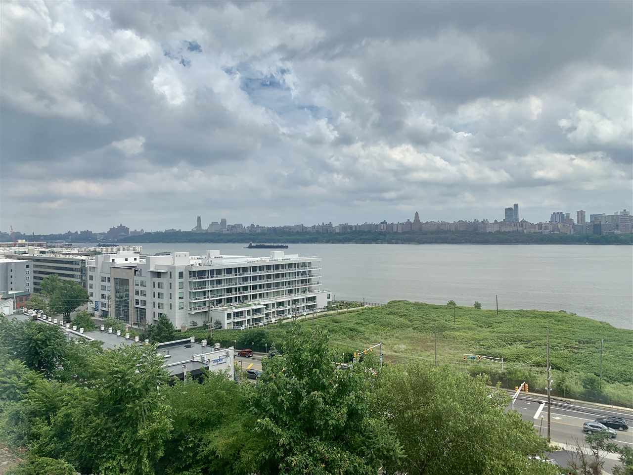22 Bergen Ridge Road, Unit 2 North Bergen, NJ 07047 - Photo 12 of 15 a view of a lake with a big yard and large trees