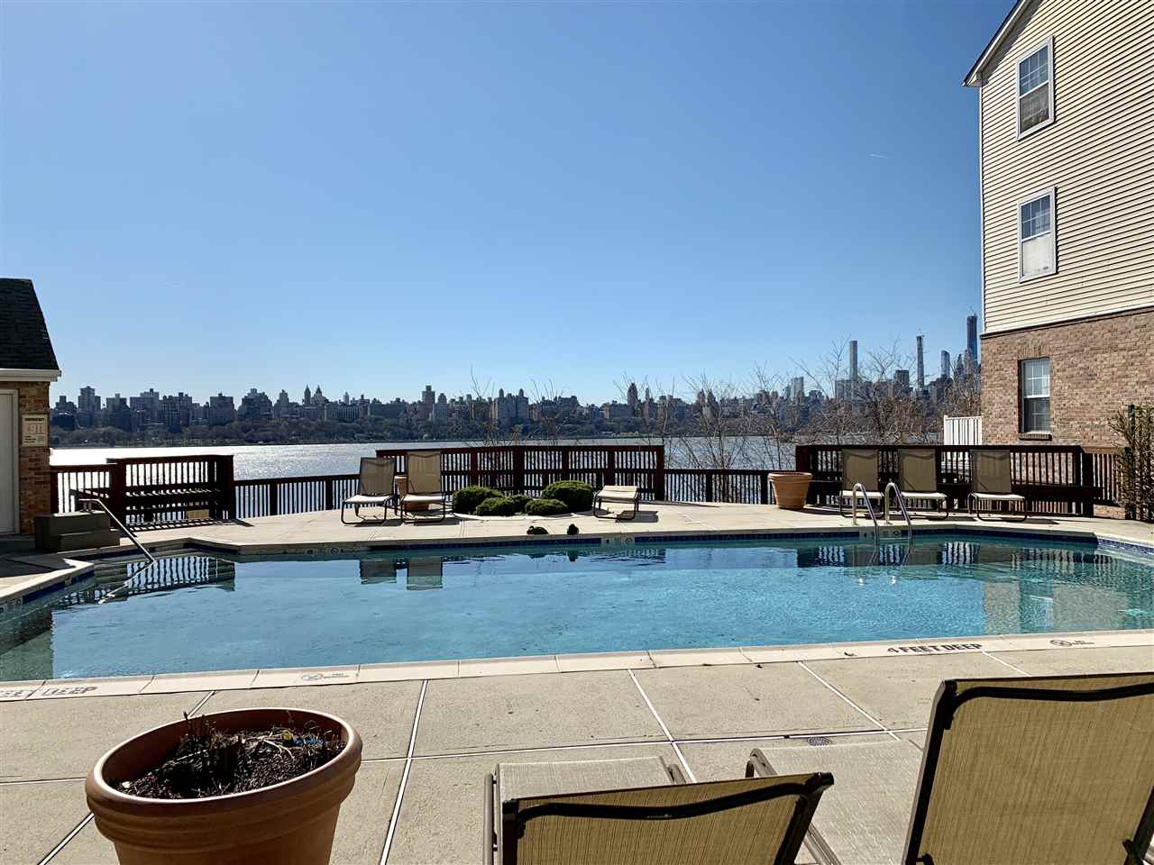 22 Bergen Ridge Road, Unit 2 North Bergen, NJ 07047 - Photo 15 of 15 a view of a swimming pool with outdoor seating