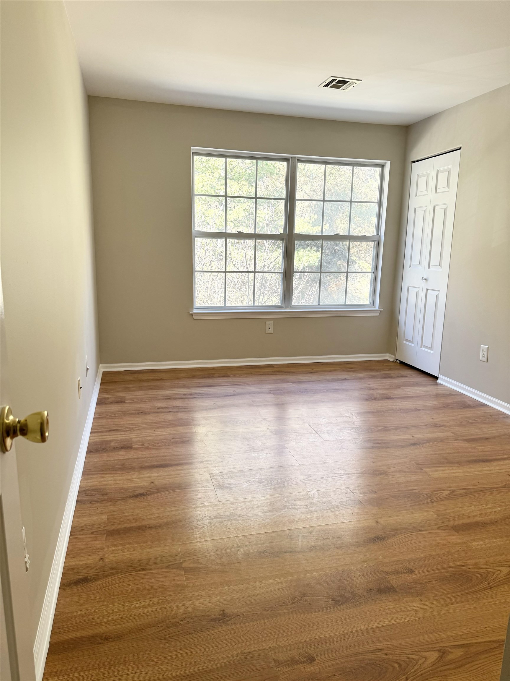 22 Bergen Ridge Road, Unit 2 North Bergen, NJ 07047 - Photo 5 of 15 wooden floor in an empty room with a window