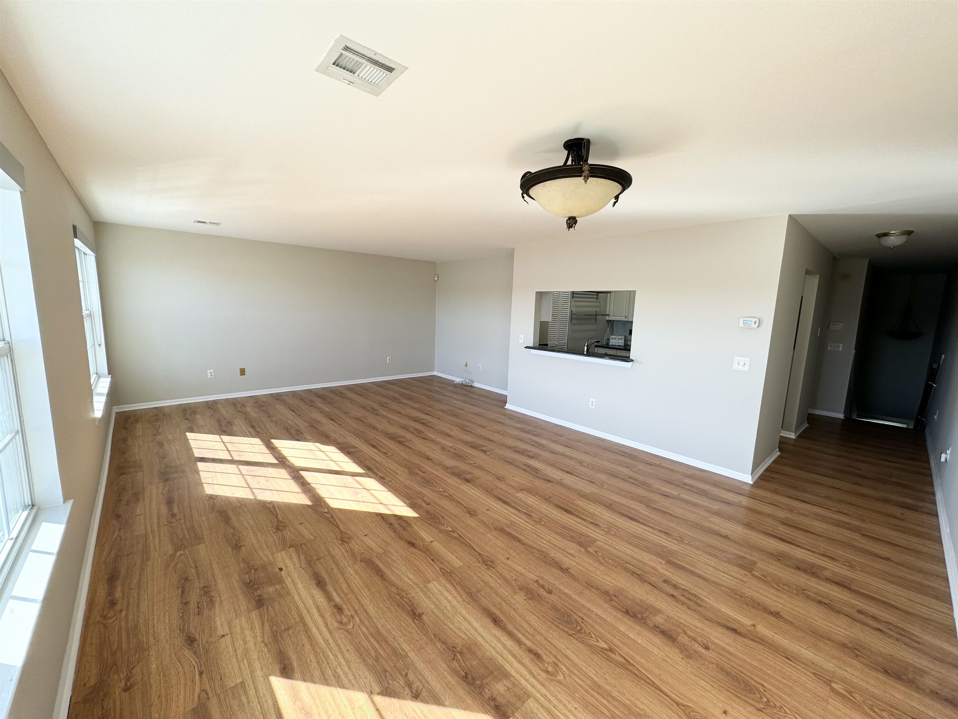 22 Bergen Ridge Road, Unit 2 North Bergen, NJ 07047 - Photo 6 of 15 wooden floor in an empty room with a window