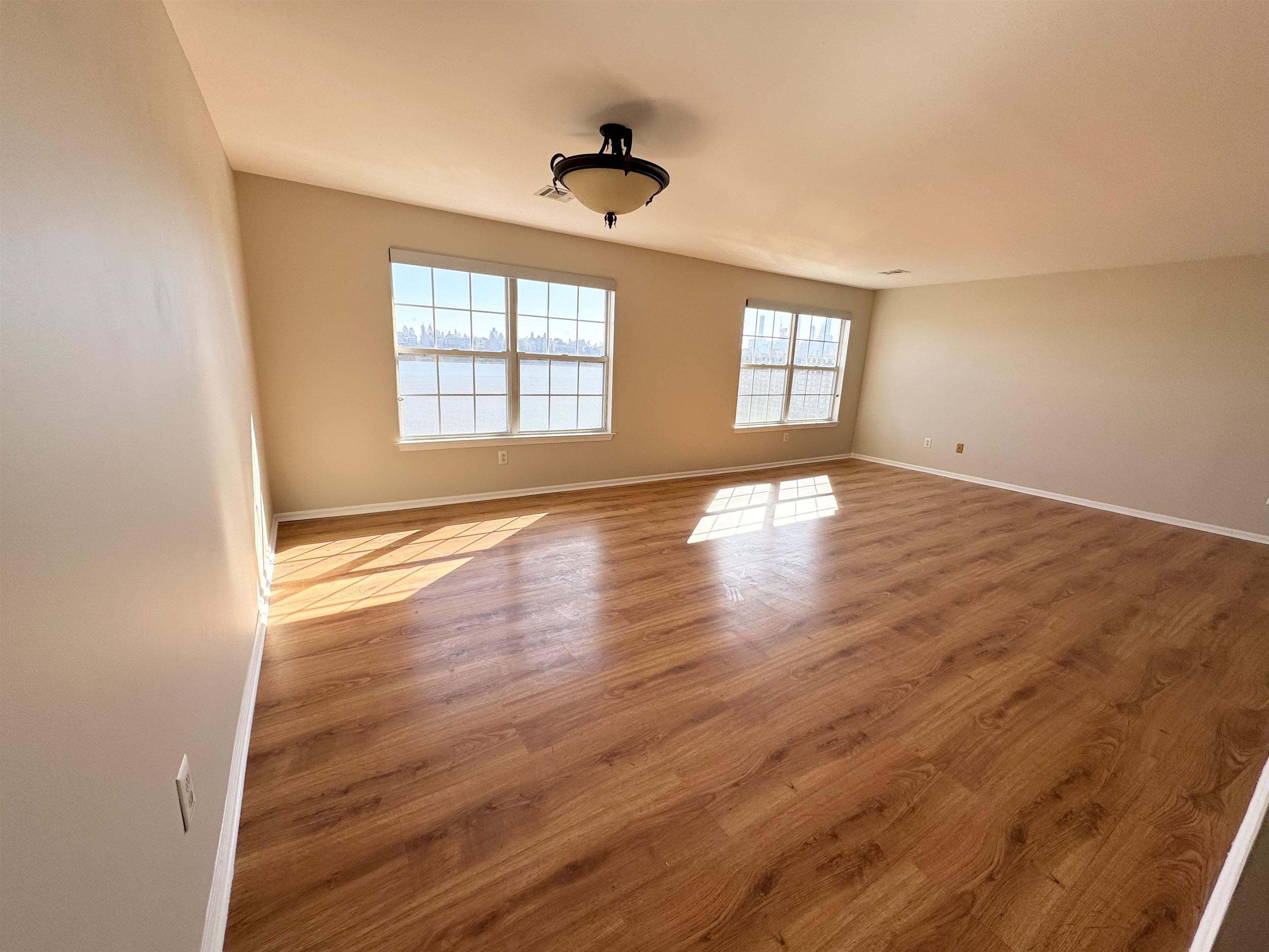 22 Bergen Ridge Road, Unit 2 North Bergen, NJ 07047 - Photo 7 of 15 wooden floor in an empty room with a window