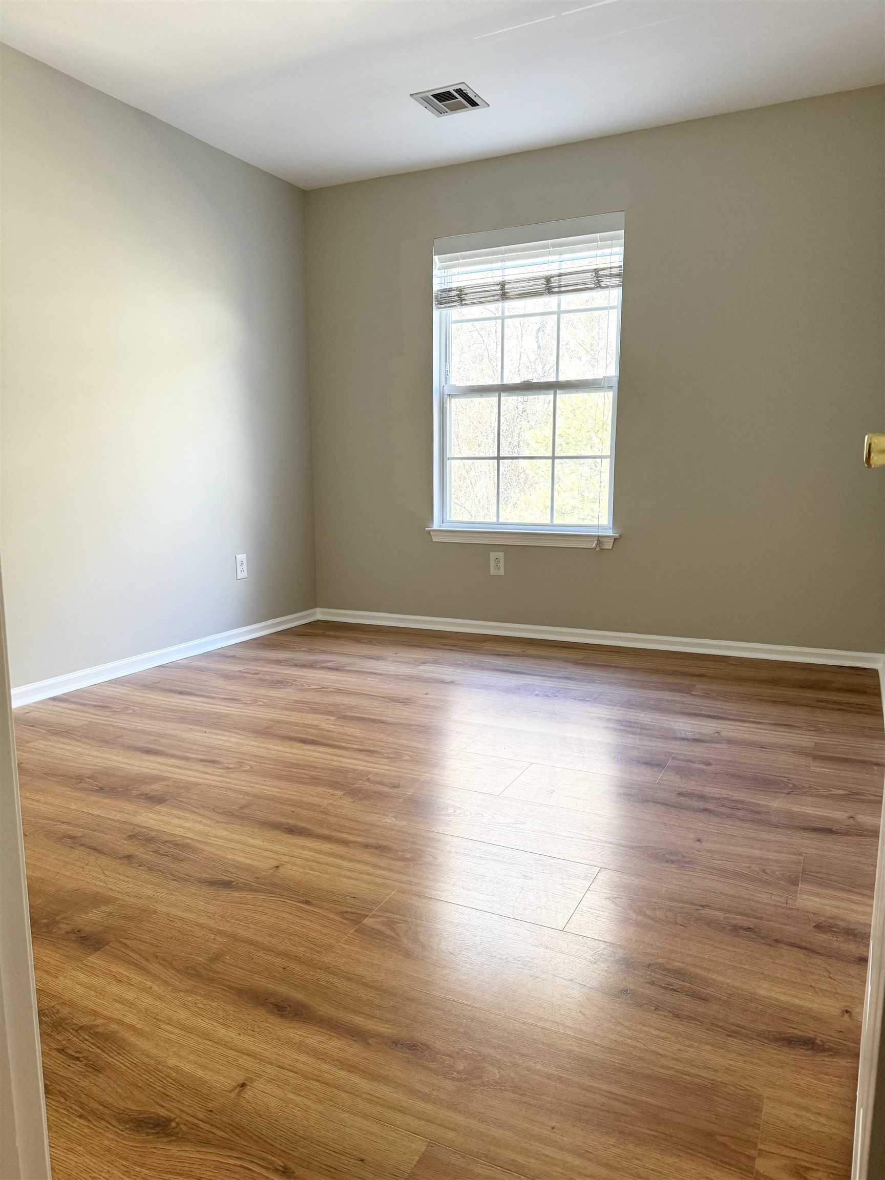 22 Bergen Ridge Road, Unit 2 North Bergen, NJ 07047 - Photo 8 of 15 wooden floor in an empty room with a window