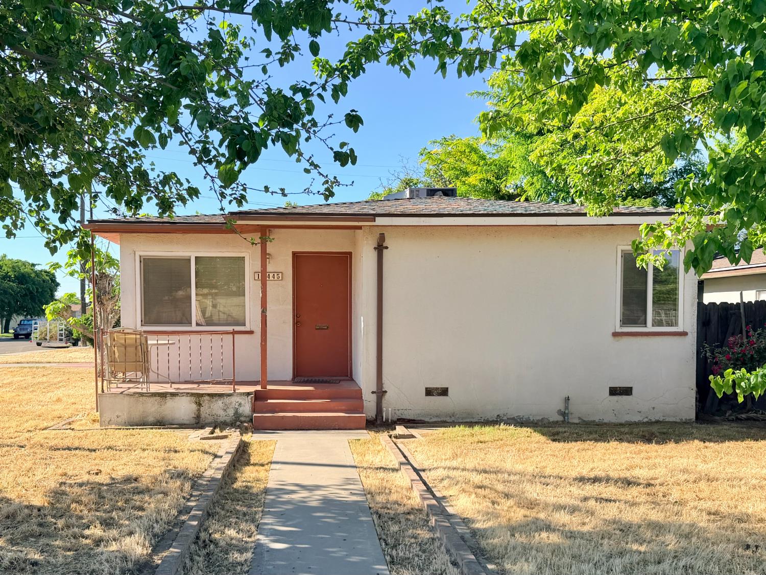 a house with trees in the background
