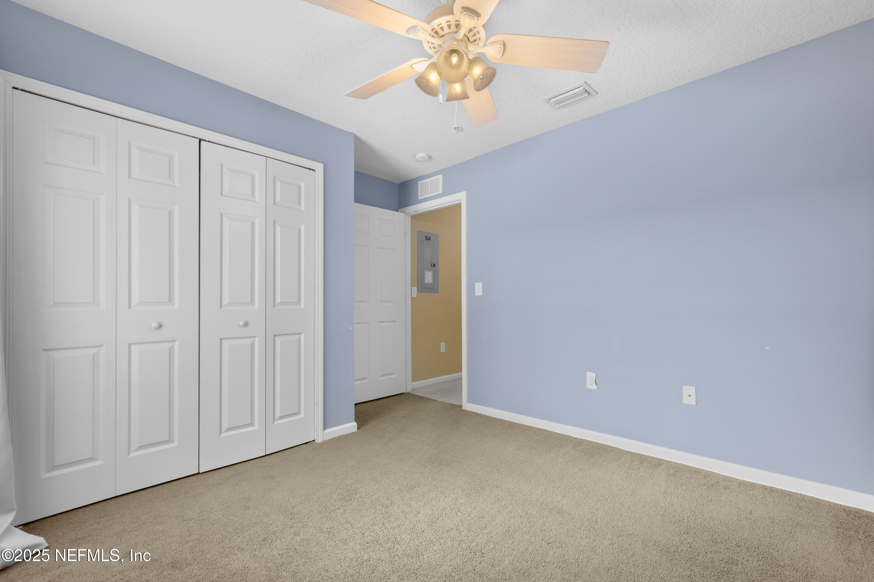 2784 Golden Lake Loop St. Augustine, FL 32084 - Photo 11 of 32 an empty room with a chandelier fan