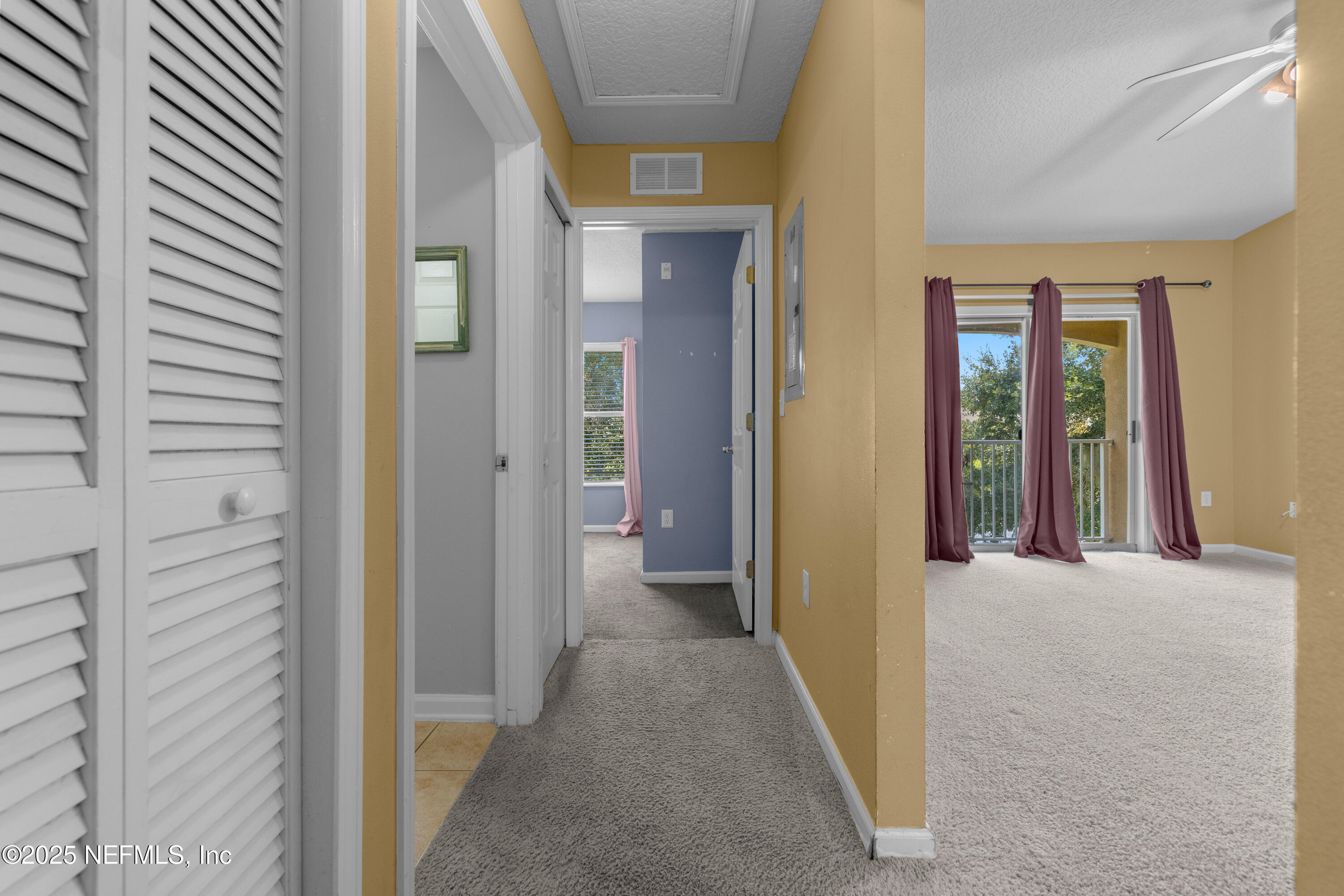 2784 Golden Lake Loop St. Augustine, FL 32084 - Photo 14 of 32 a view of a hallway with wooden shelves