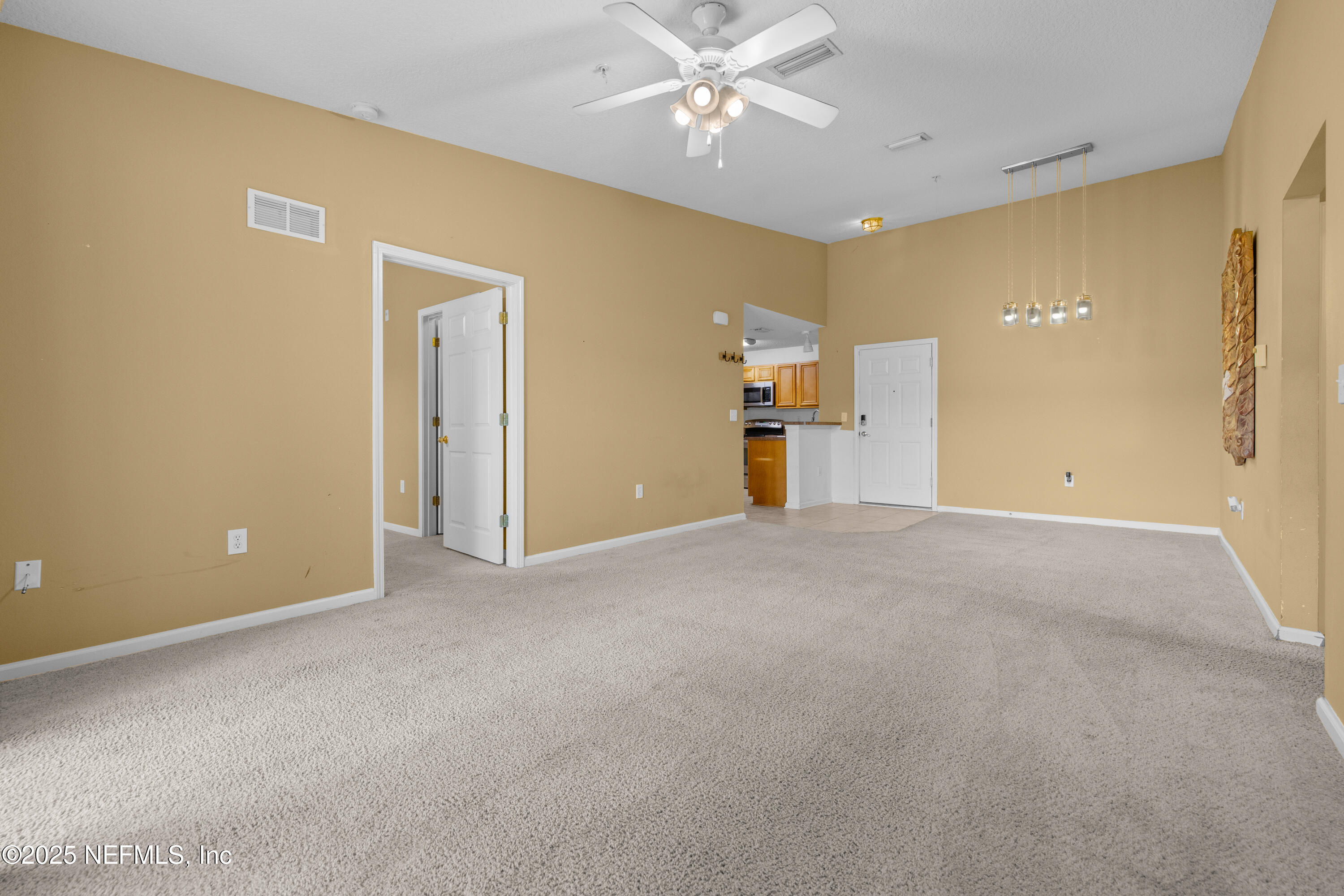 2784 Golden Lake Loop St. Augustine, FL 32084 - Photo 17 of 32 a view of a livingroom with a chandelier fan