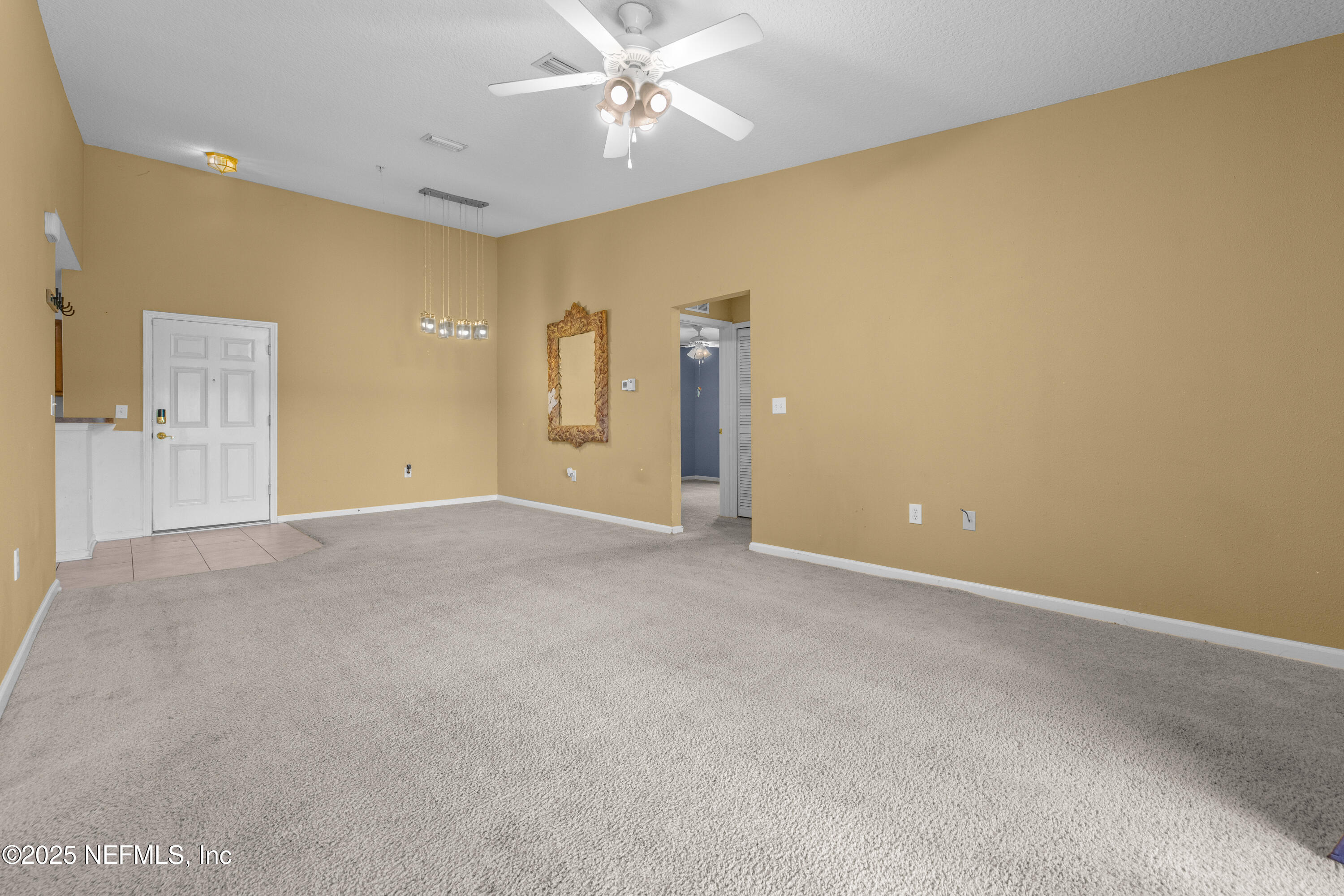 2784 Golden Lake Loop St. Augustine, FL 32084 - Photo 18 of 32 a view of an empty room with a ceiling fan