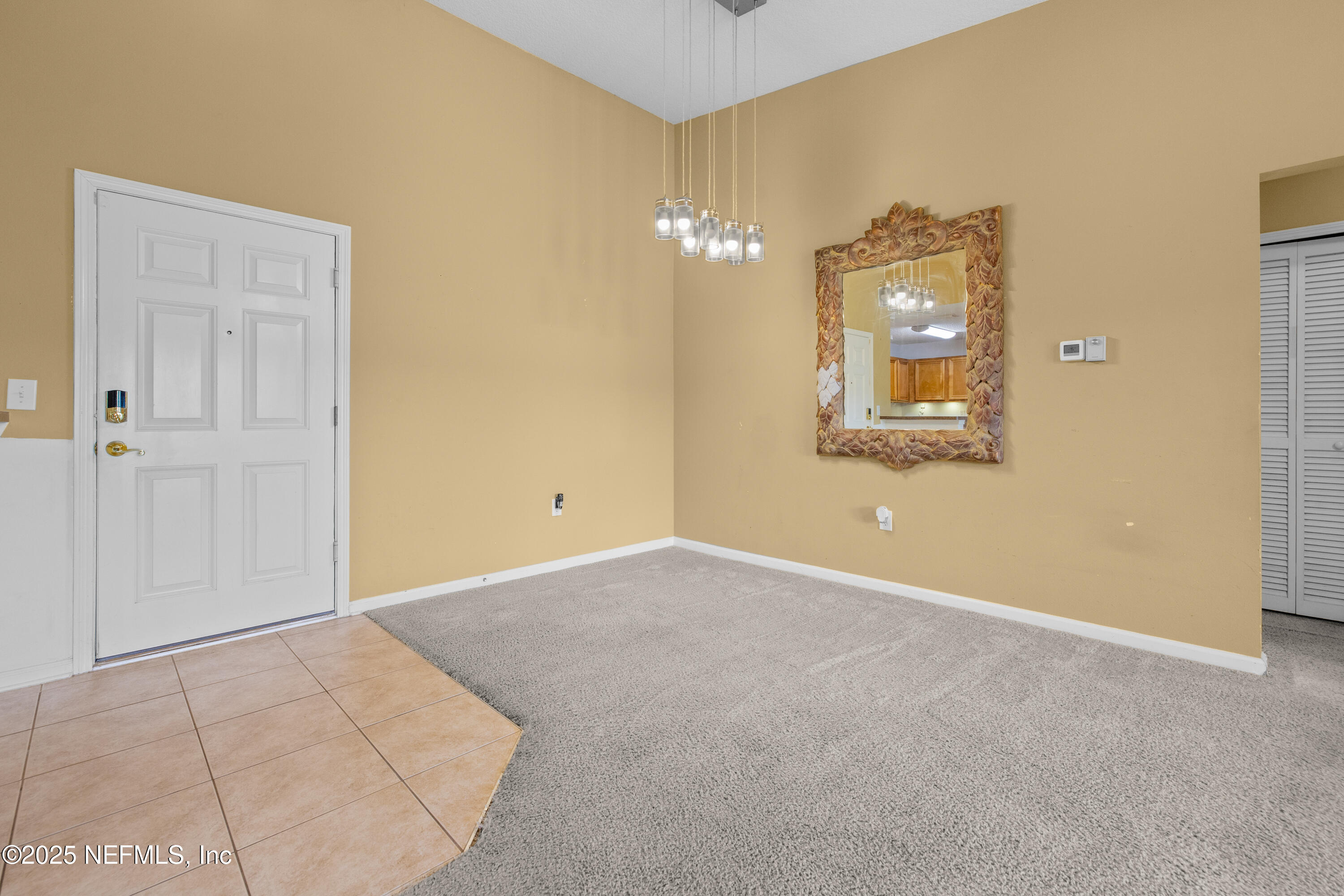 2784 Golden Lake Loop St. Augustine, FL 32084 - Photo 19 of 32 an empty room with a mirror