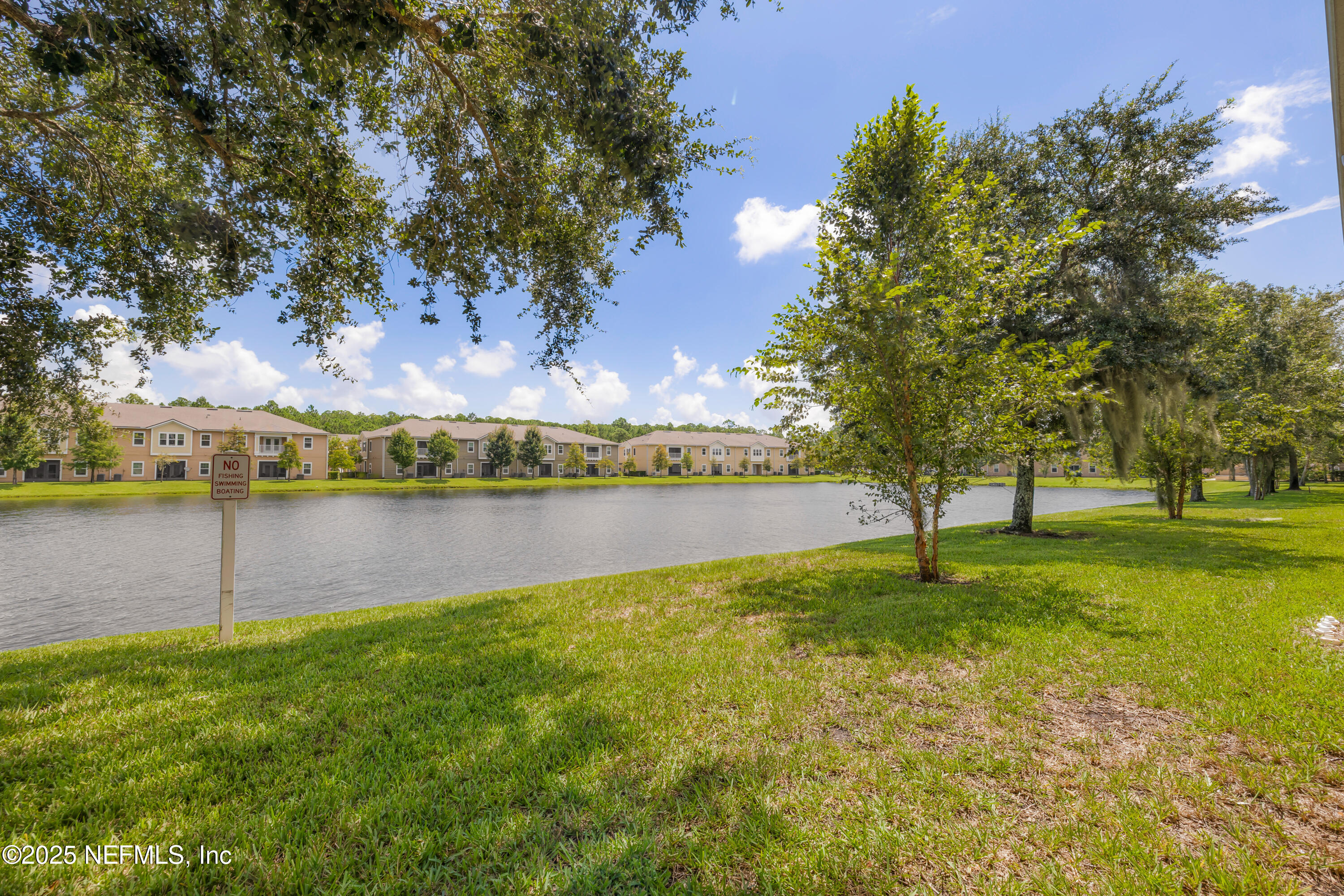 2784 Golden Lake Loop St. Augustine, FL 32084 - Photo 29 of 32 a view of a lake with a yard