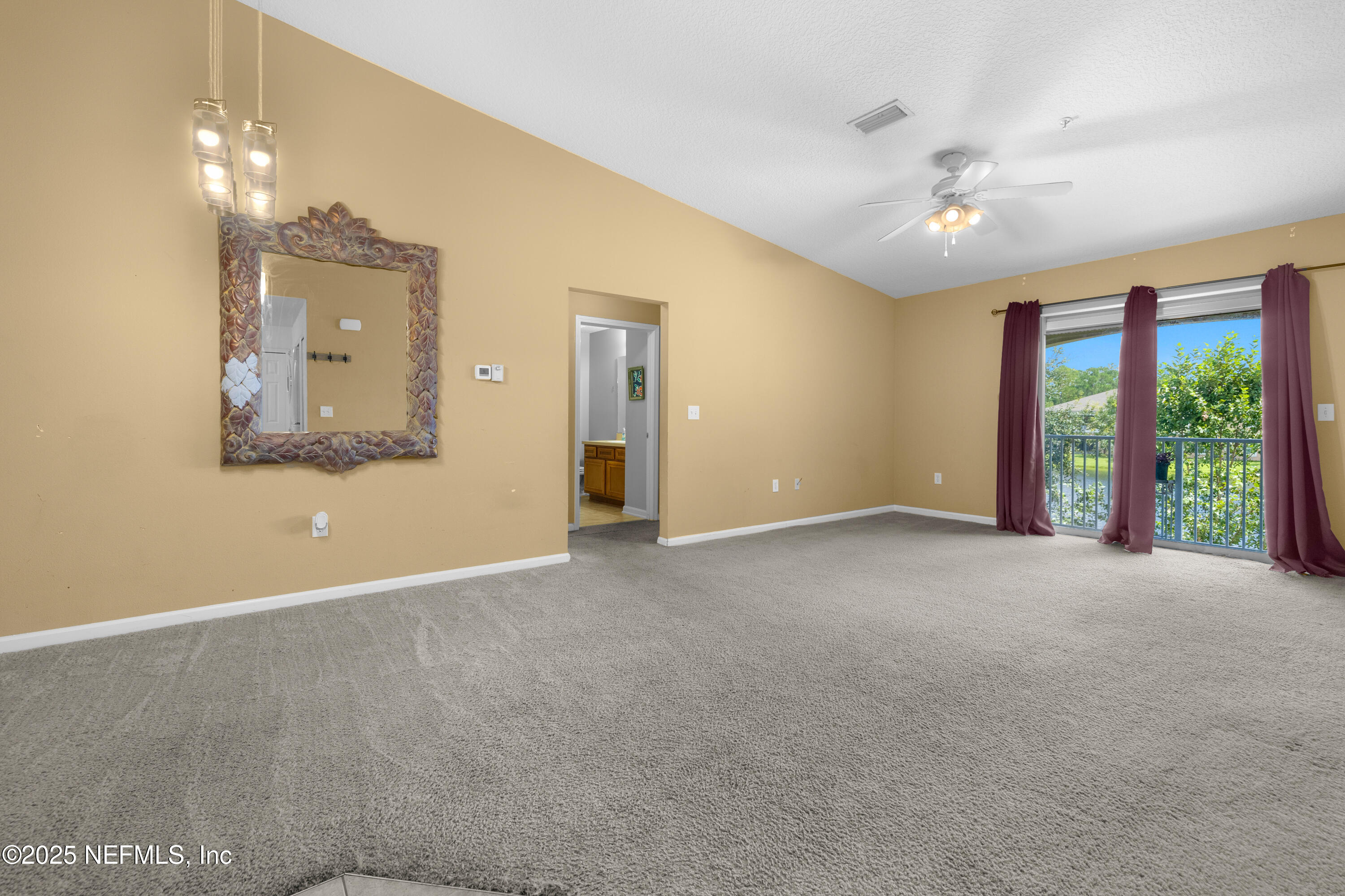 2784 Golden Lake Loop St. Augustine, FL 32084 - Photo 3 of 32 a view of an empty room with a window