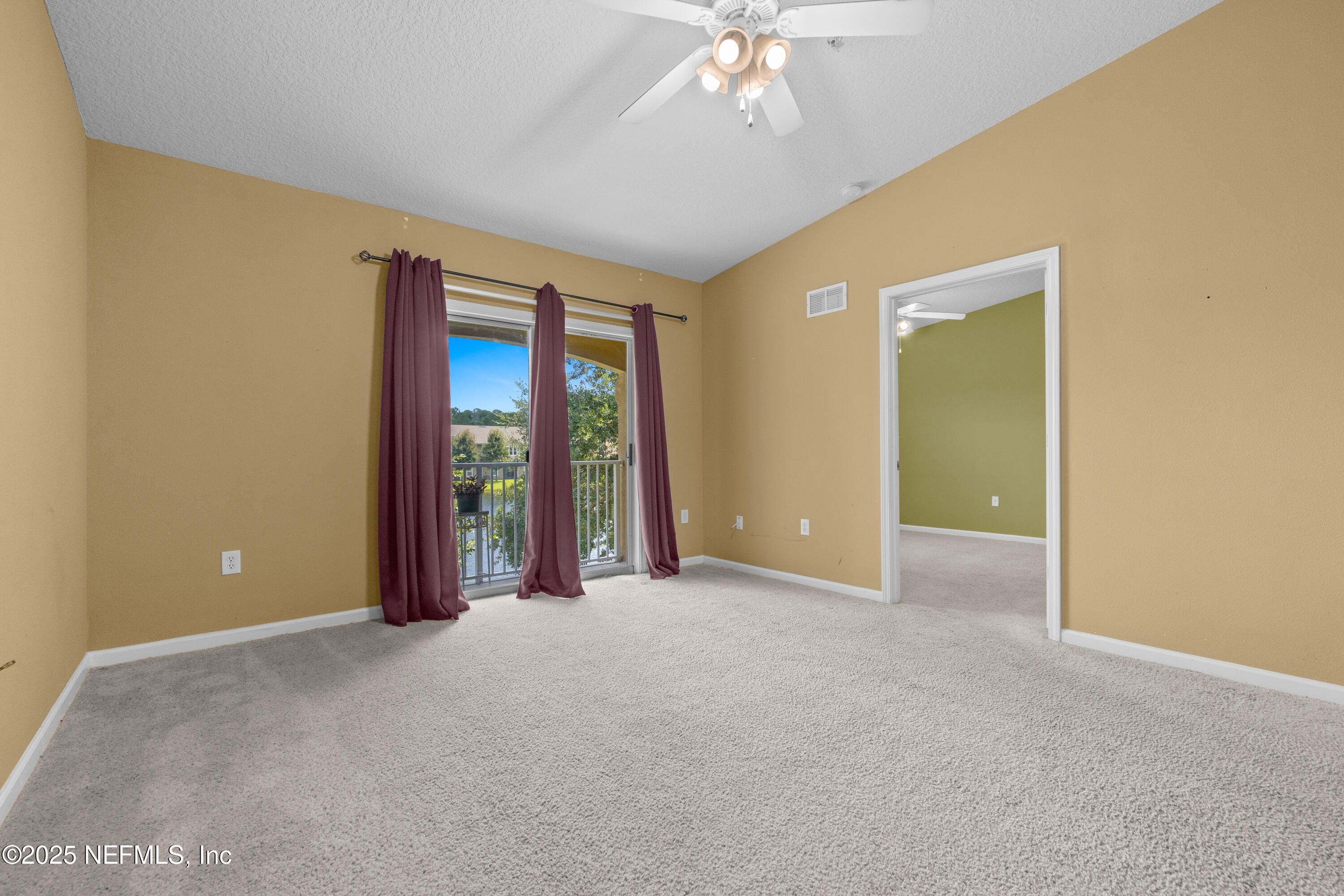 2784 Golden Lake Loop St. Augustine, FL 32084 - Photo 6 of 32 a view of an empty room with chandelier fan and window