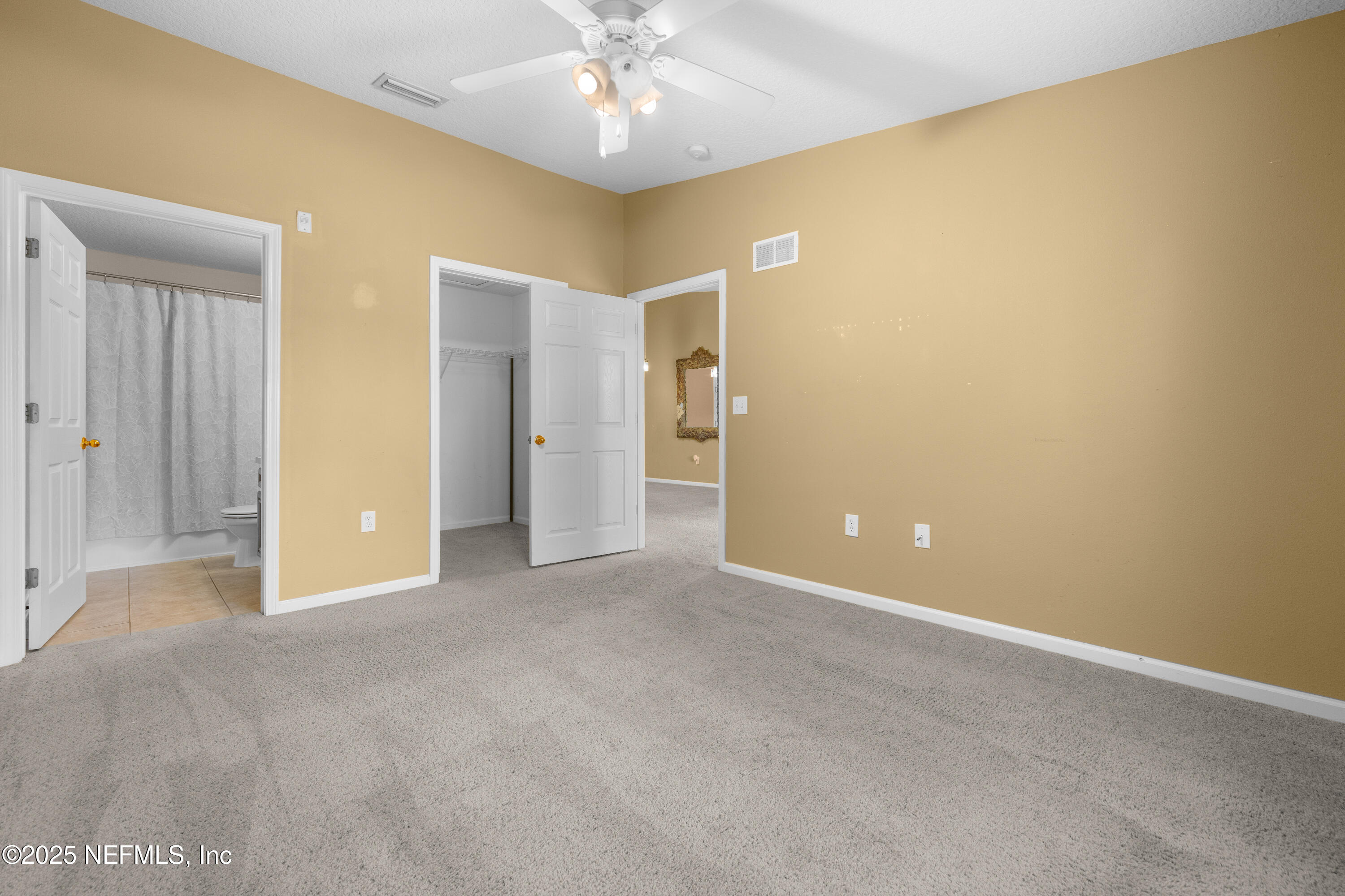 2784 Golden Lake Loop St. Augustine, FL 32084 - Photo 8 of 32 an empty room with chandelier fan