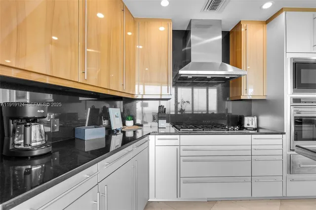 a kitchen with appliances cabinets and a counter top space
