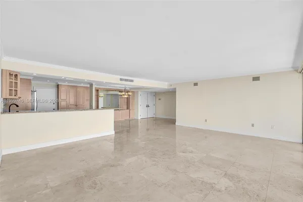 a kitchen with a stove a refrigerator and a sink
