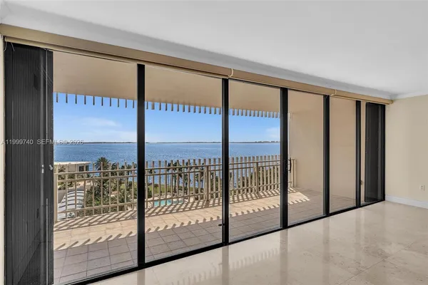 a kitchen with white cabinets stainless steel appliances and sink