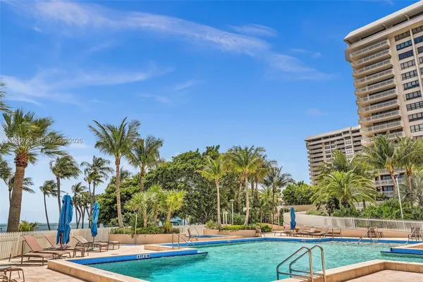 a spacious bedroom with a bed and a couch
