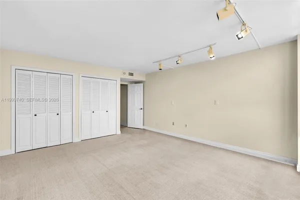 a view of a lake with tall buildings