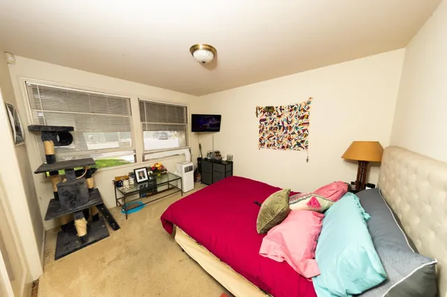 a bathroom with a double vanity sink toilet and shower