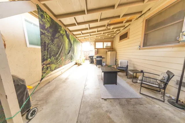 a view of a balcony with furniture
