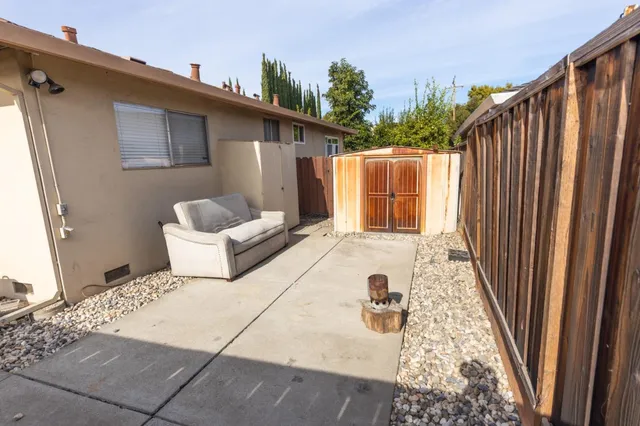 a view of a balcony with wooden floor