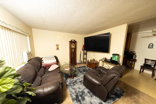a kitchen with stainless steel appliances kitchen island a stove and a microwave