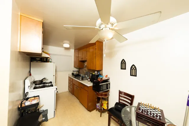 a view of a living room with clothes and shoes