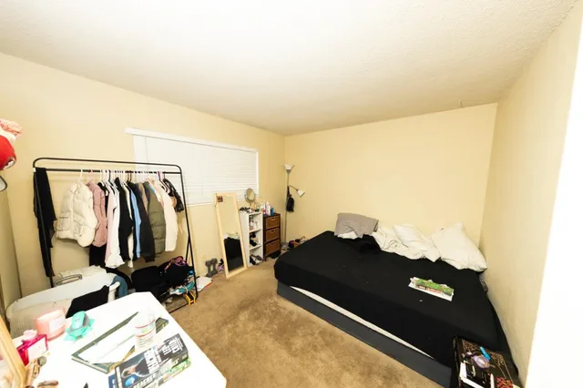 a view of a backyard from a balcony