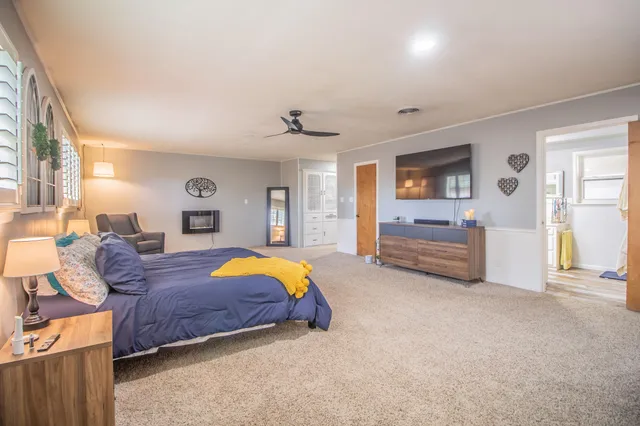 a view of walk in closet with empty room