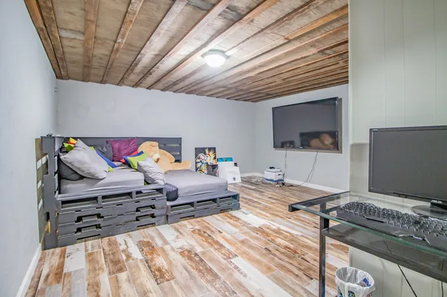a bedroom with a bed and a book shelf
