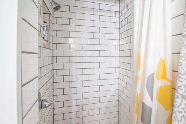 a bathroom with a bathtub and shower