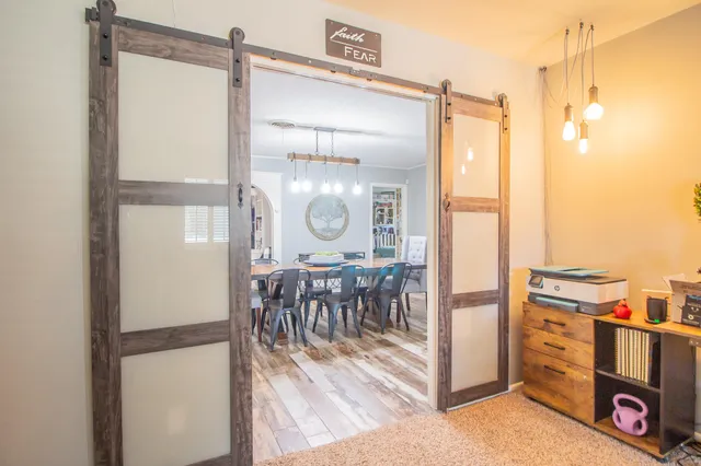 a view of kitchen with kitchen island and stainless steel appliances