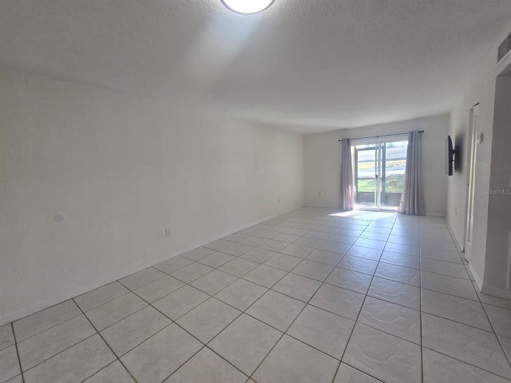 902 Lake Destiny Road, Unit C Altamonte Springs, FL 32714 - Photo 4 of 23 an empty room with windows