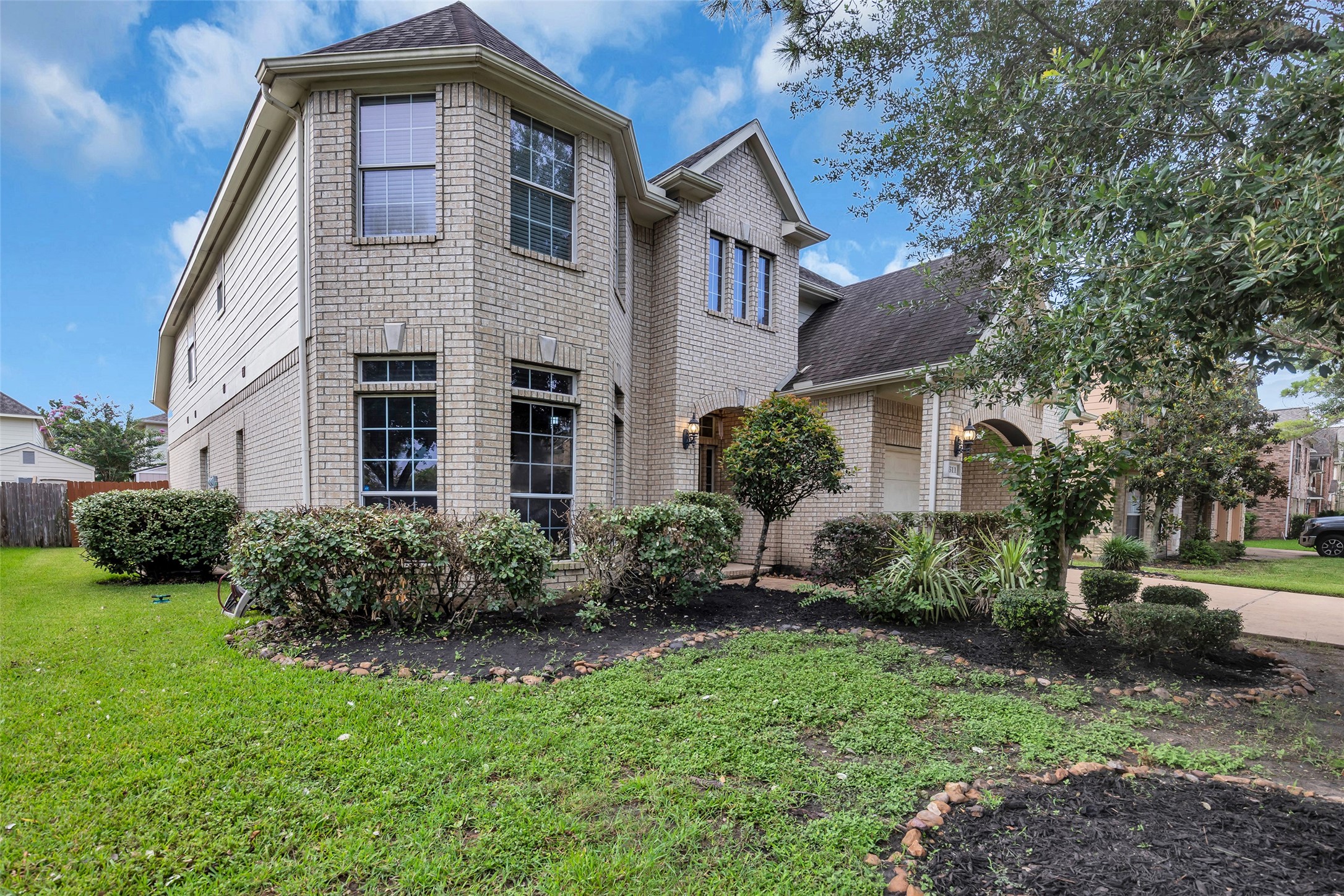 611 River Delta Lane Rosenberg, TX 77469 - Photo 36 of 39 a front view of a house with garden