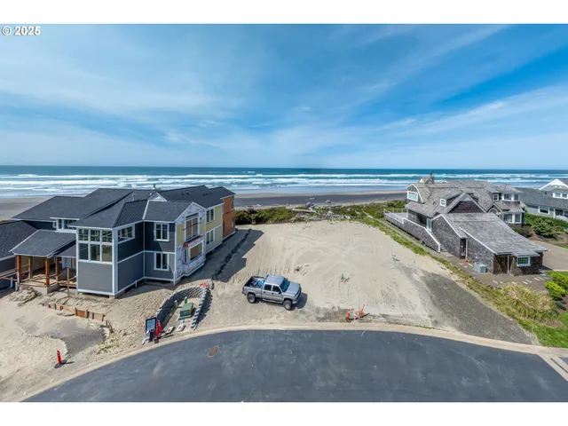 a view of roof deck with two couches and a potted plant