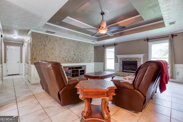 a living room with furniture and a fireplace