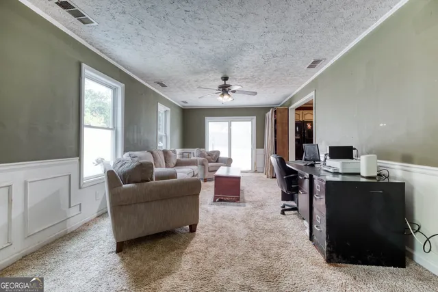a living room with furniture and window