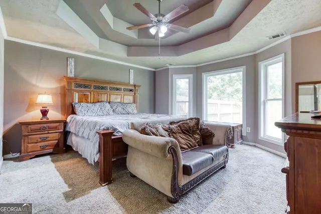 a bed room with a bed and a couch