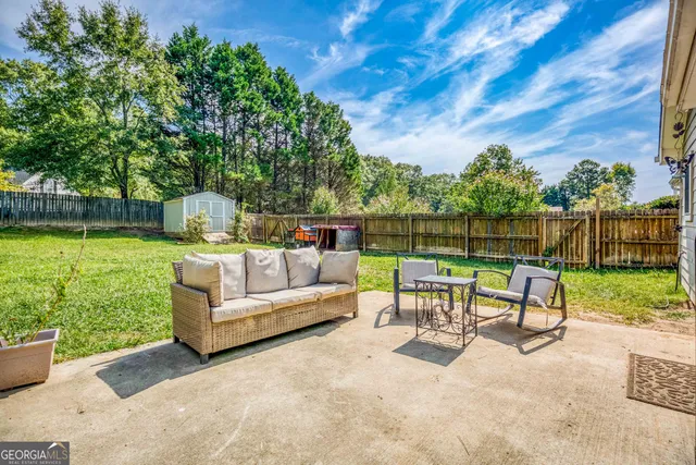 a view of a bench in the backyard