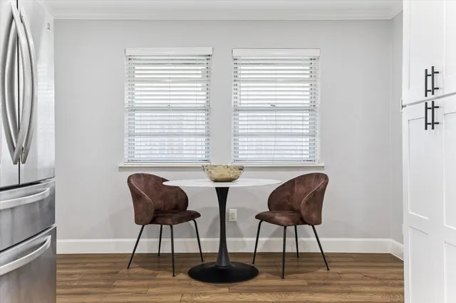 a view of a livingroom with furniture and a window