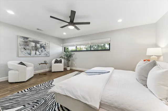 a bedroom with a bed and a couch