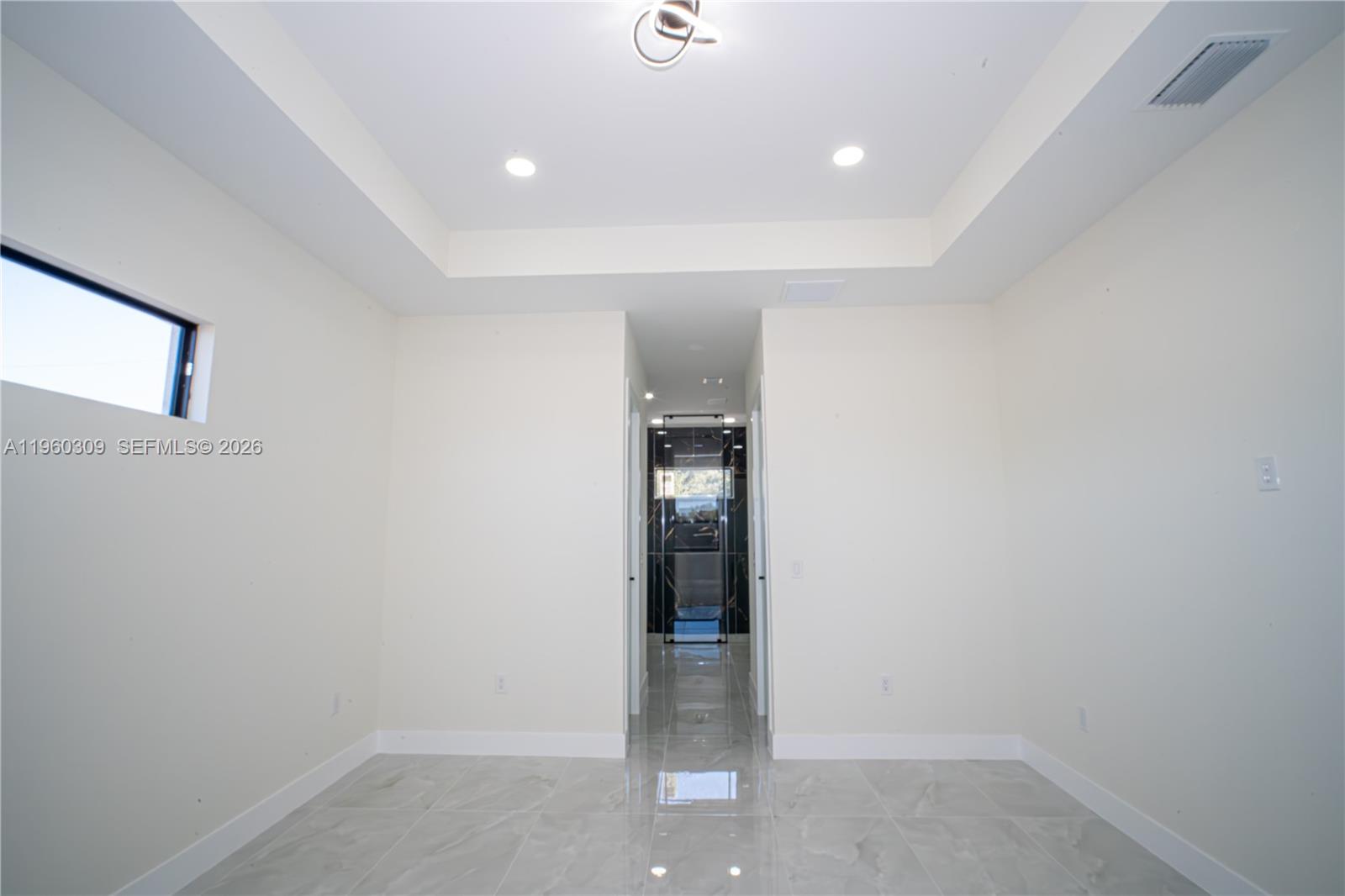2903 East 17th Street Lehigh Acres, FL 33972 - Photo 29 of 34 wooden floor in an empty room