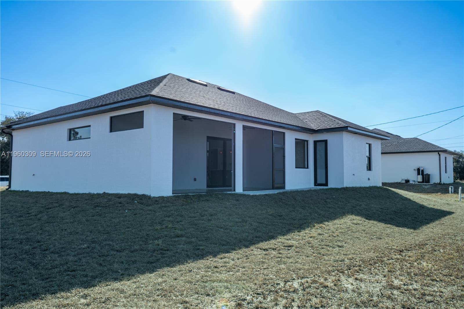 2903 East 17th Street Lehigh Acres, FL 33972 - Photo 32 of 34 a front view of a house with garden