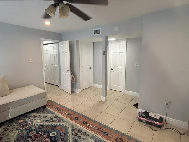 a spacious bedroom with a bed and furniture