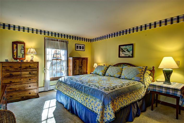 80 Sea Robin Road Osterville, MA 02655 - Photo 13 of 20 a bedroom with a bed a dresser and with chair