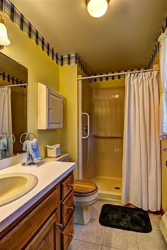80 Sea Robin Road Osterville, MA 02655 - Photo 15 of 20 a bathroom with a sink a toilet and shower