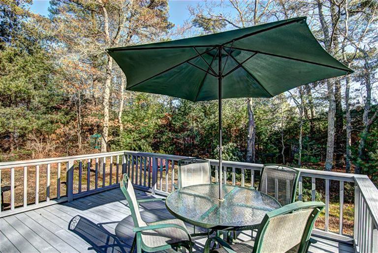 80 Sea Robin Road Osterville, MA 02655 - Photo 18 of 20 a view of balcony with outdoor seating and wooden floor