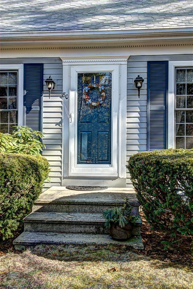 80 Sea Robin Road Osterville, MA 02655 - Photo 20 of 20 a front view of a house with a garden